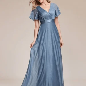 Robe de soirée bleue longue à volants et décolleté plongeant